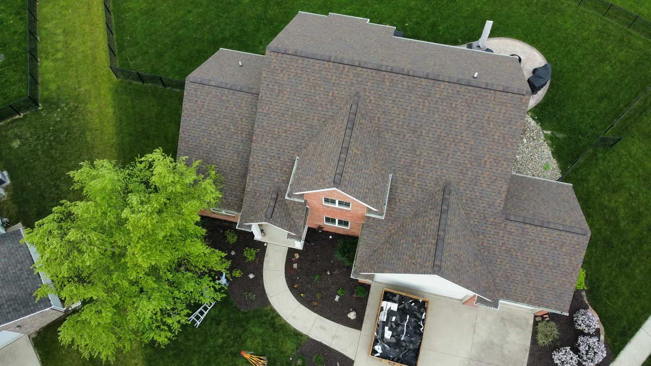 Aerial view of a shingle roof showing intersecting slopes, ridges and valleys
